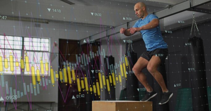 Jumping man performing plyo box jump at gym, blue shirt black shorts, analytics overlay, copy space