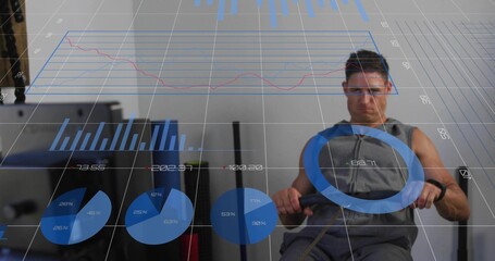 Pulling man wearing sleeveless gray top and wristband on rower in gym, HUD analytics, copy space © vectorfusionart