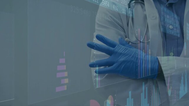 Doctor standing cross-armed, stethoscope and gloves watching data update animating medical charts