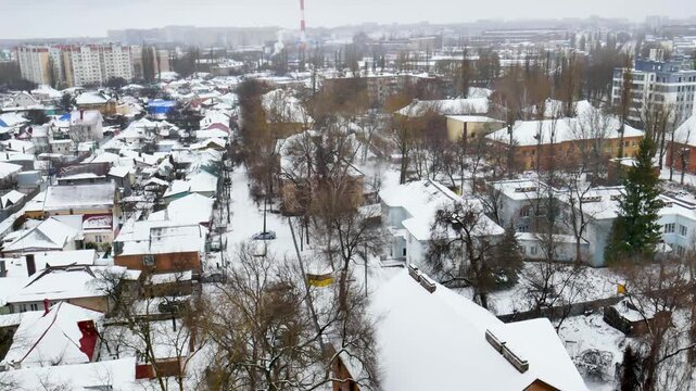 Voronezh, Russia, January 3, 2026: Winter residential area of ​​Voronezh with private sector and multi-story buildings, view from above