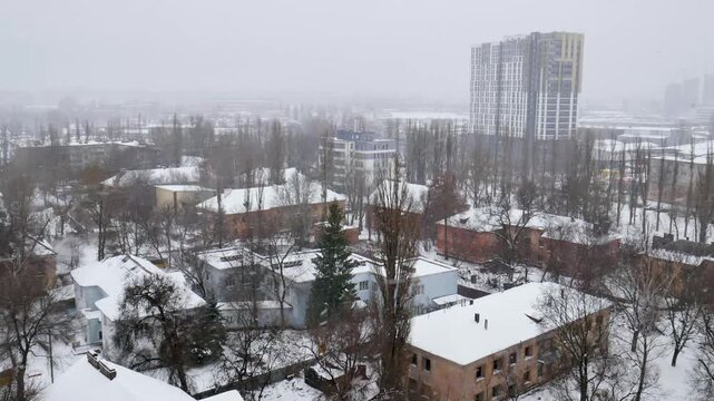 Voronezh, Russia, January 3, 2026: Winter residential area of ​​Voronezh with private sector and multi-story buildings, view from above