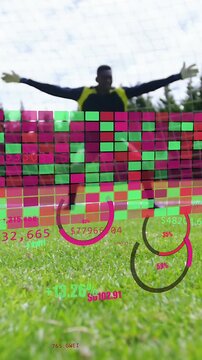 Vertical video: GK moving in, striker sliding to score on rolling football, AR overlaying players