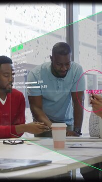 Vertical video: Team leaning over docs tapping phone, showing AR business metrics with pink target