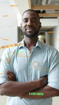 Vertical video: Man shifting gaze in office with crypto overlays appearing, smiling at market gains