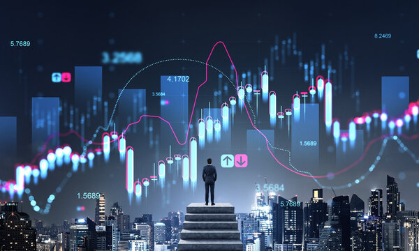 Man watching financial charts over modern urban cityscape at night.