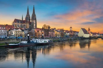 Old town of Regensburg, Germany on the Danube river at sunset © Mapics