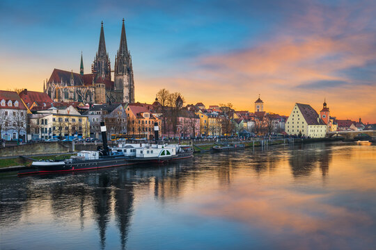 Old town of Regensburg, Germany on the Danube river at sunset