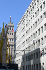 Naklejka premium looking north on Simcoe St (south of Queen St W) to Canada Life Building and sign location of a future Ontario Line station, Toronto