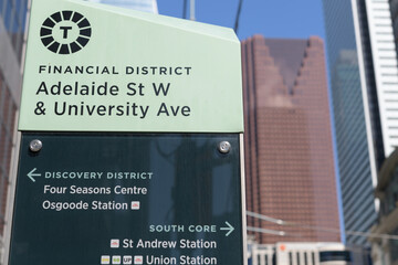 Fototapeta premium location marker in the Toronto Financial District at Adelaide St W and University Ave with defocused view of Scotia Plaza