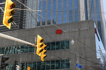 Fototapeta premium sign on the exterior of National Bank at 121 King St W inside Roserock Place, Toronto