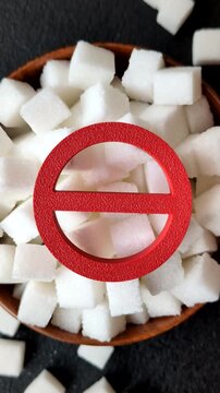 The sugar ban sign as a concept to stop the problem of diabetes and obesity, a call to diet. The sugar ban sign as a background for your design