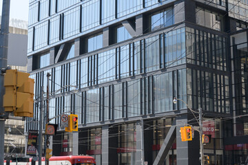 Naklejka premium exterior building facade and sign of CIBC bank branch at 460 University Av (at Dundas St W), Toronto