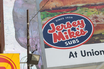 Naklejka premium roadside billboard advertisement for Jersey Mike's at Union Station at parking lot near Revery Toronto Downtown, Adelaide St W, Toronto