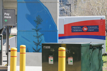 Naklejka premium City of Toronto municipal parking space with defocused Canada Post delivery truck under the elevated Gardiner Expressway, known as The Bentway, Toronto
