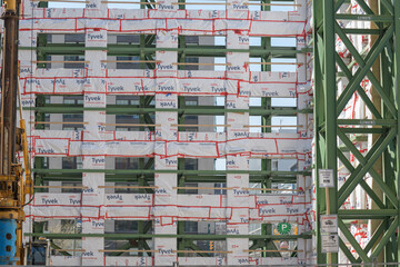 Naklejka premium facade retention system (of a property at 355 Adelaide St W) with weatherproofing membrane, Queen Spadina station complex, Ontario Line, Toronto