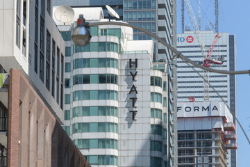 Fototapeta premium looking west on King St W to sign outside Hyatt Regency (a hotel located at 370 King W) and FORMA condos, and BMO at First Canadian Place, Toronto
