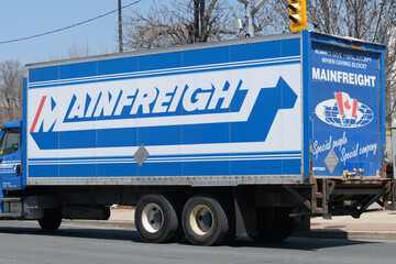 Fototapeta premium view of Mainfreight, an international logistics and freight forwarding company, truck in Toronto