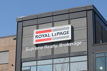 Fototapeta premium exterior building facade and sign of Royal LePage Supreme Realty, Brokerage, a real estate agency, located at 110 Weston Rd, Toronto