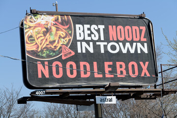 Fototapeta premium roadside billboard with advertising for Noodlebox, a fast food restaurant that specializes in Southeast Asian-style street food, Toronto