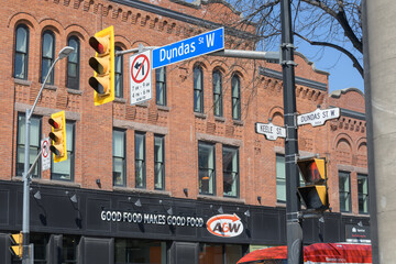 Obraz premium exterior building and sign of A&W Canada, a hamburger restaurant chain, located here at 2858 Dundas St W (northwest corner) in historic Campbell Block, The Junction, Toronto