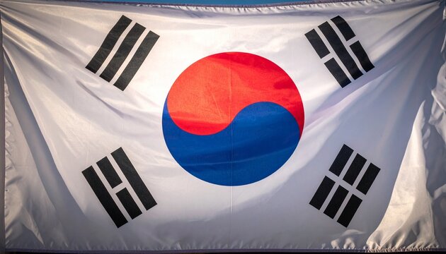 South Korean flag waving fabric with bold taegeuk symbol and black trigrams on white background detailed texture lighting realistic high-resolution