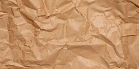 Obraz premium crumpled brown paper background,Crumpled Paper Poster Photo Effect Mockup,Crumpled Paper texture overlay effec,crumpled kraft paper background