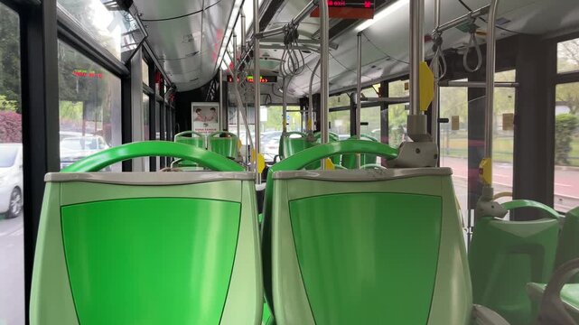 Interior of a Modern Bus: The modern bus interior features empty seats, showcasing the design and layout of public transport