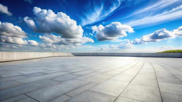 Expansive paved plaza overlooking a vibrant summer sky filled with fluffy cumulus clouds