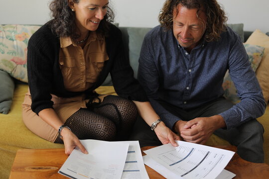 Couple Reviewing Documents Together
