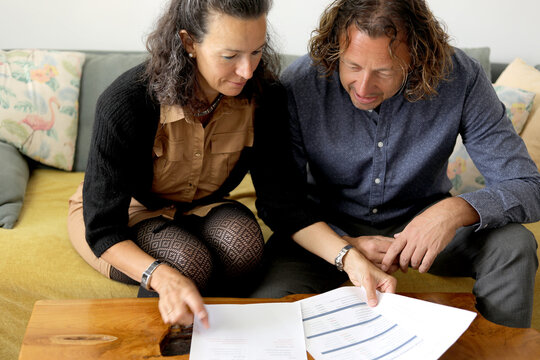 Couple Reviewing Documents Together