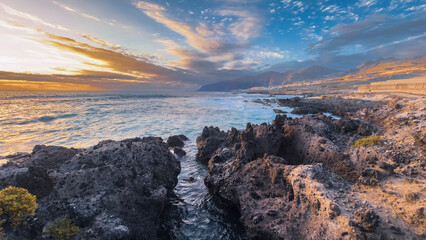 Golden hour light over rocky ocean coast in tropical island Tenerife Spain © Victoria Schaad
