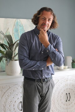 Man Pondering Indoors