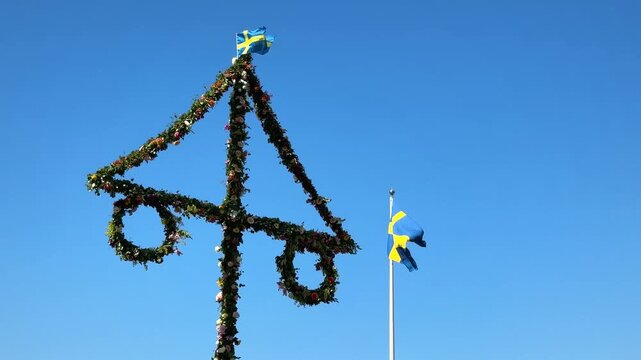Midsummer festival in Sweden.Dancing around a pole celebrating middle of summer