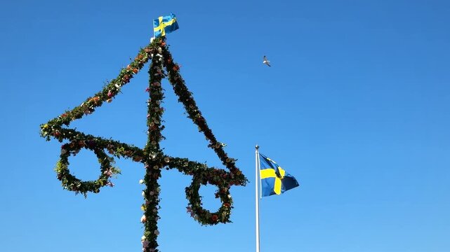 Midsummer festival in Sweden.Dancing around a pole celebrating middle of summer