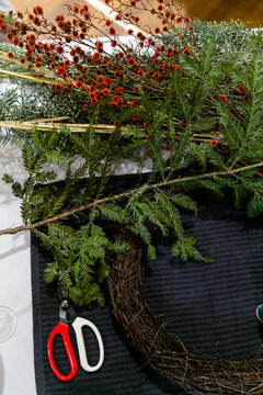 A flat lay of Christmas wreath supplies