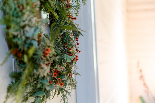 Side view of a hanging Christmas wreath