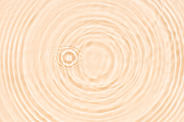 Fototapeta premium Cream water with ripples on the surface. Defocus blurred transparent white colored clear calm water surface texture with splashes and bubbles. Water waves with shining pattern texture background.
