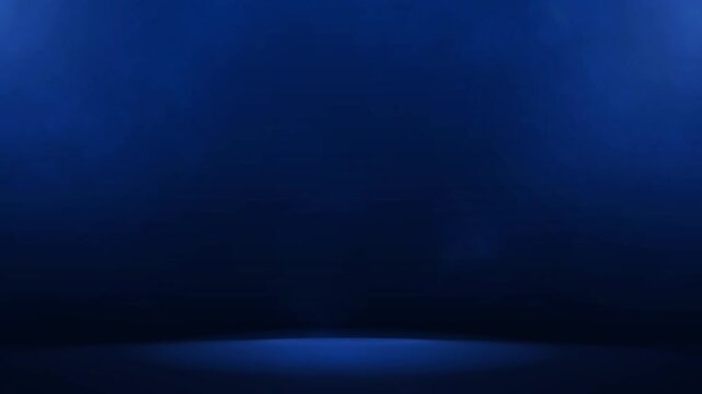 The studio background is dark blue with smoky light.