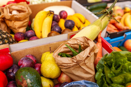 Colourful fresh food in boxes at organic fruit and veg farm to table food hub