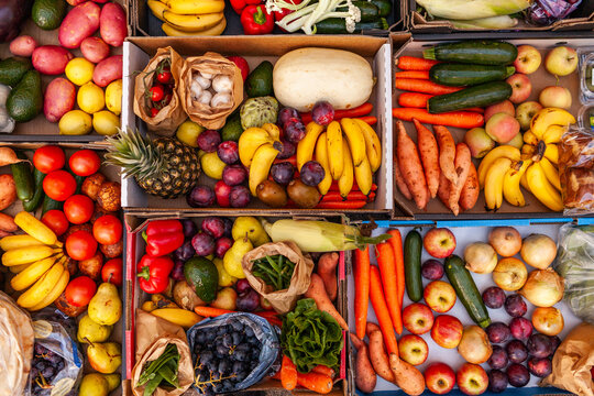 Colourful overhead angle of fresh organic fruit and vegetable boxes at unsupermarket food hub