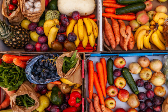 Colourful overhead angle of fresh organic fruit and vegetable boxes at unsupermarket food hub