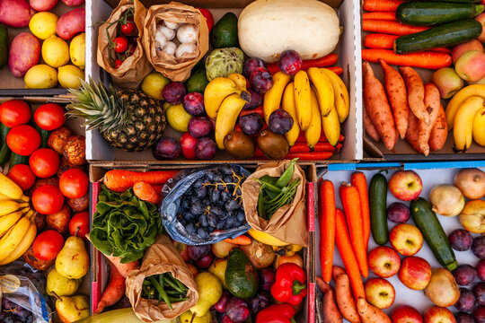 Colourful overhead angle of fresh organic fruit and vegetable boxes at unsupermarket food hub