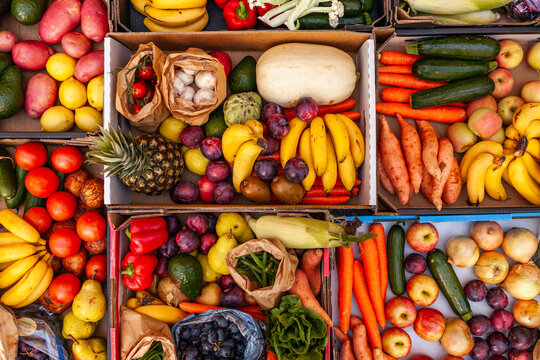 Colourful overhead angle of fresh organic fruit and vegetable boxes at unsupermarket food hub