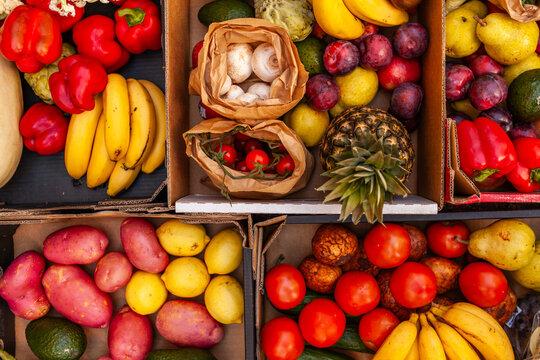 Colourful overhead angle of fresh organic fruit and vegetable boxes at unsupermarket food hub