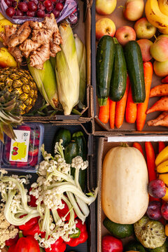 Colourful overhead angle of fresh organic fruit and vegetable boxes at unsupermarket food hub