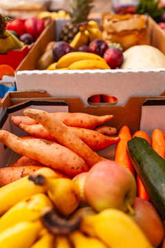 Colourful fresh food in boxes at organic fruit and veg farm to table food hub
