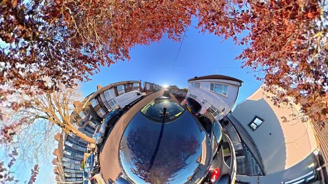 Ultra Wide Footage of British Urban City Streets During Car Drive. The Footage Was Captured with Car Roof Mounted 360 Camera During Sunny Day