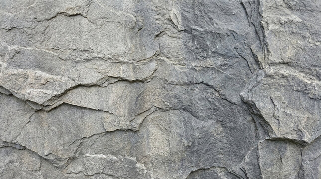 Stone Texture Background Of A Gray Rock Wall With Natural Cracks
