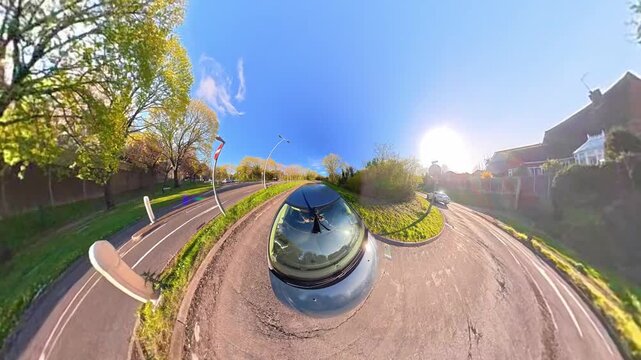Ultra Wide Footage of British Urban City Streets During Car Drive. The Footage Was Captured with Car Roof Mounted 360 Camera During Sunny Day