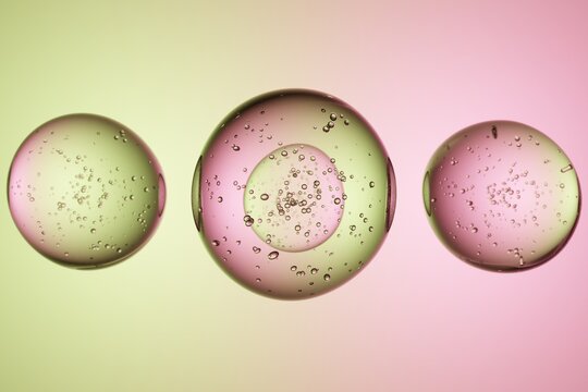 Transparent spheres with bubbles, gradient background, 3D render